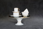  Forest green and gold pedestal cake stand styled with white cups and elegant tableware