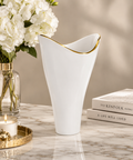  White porcelain vase with gold trim styled on a table for elegant modern home decor