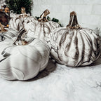 Black and white marble pumpkin decor with gold stems for elegant fall home decor