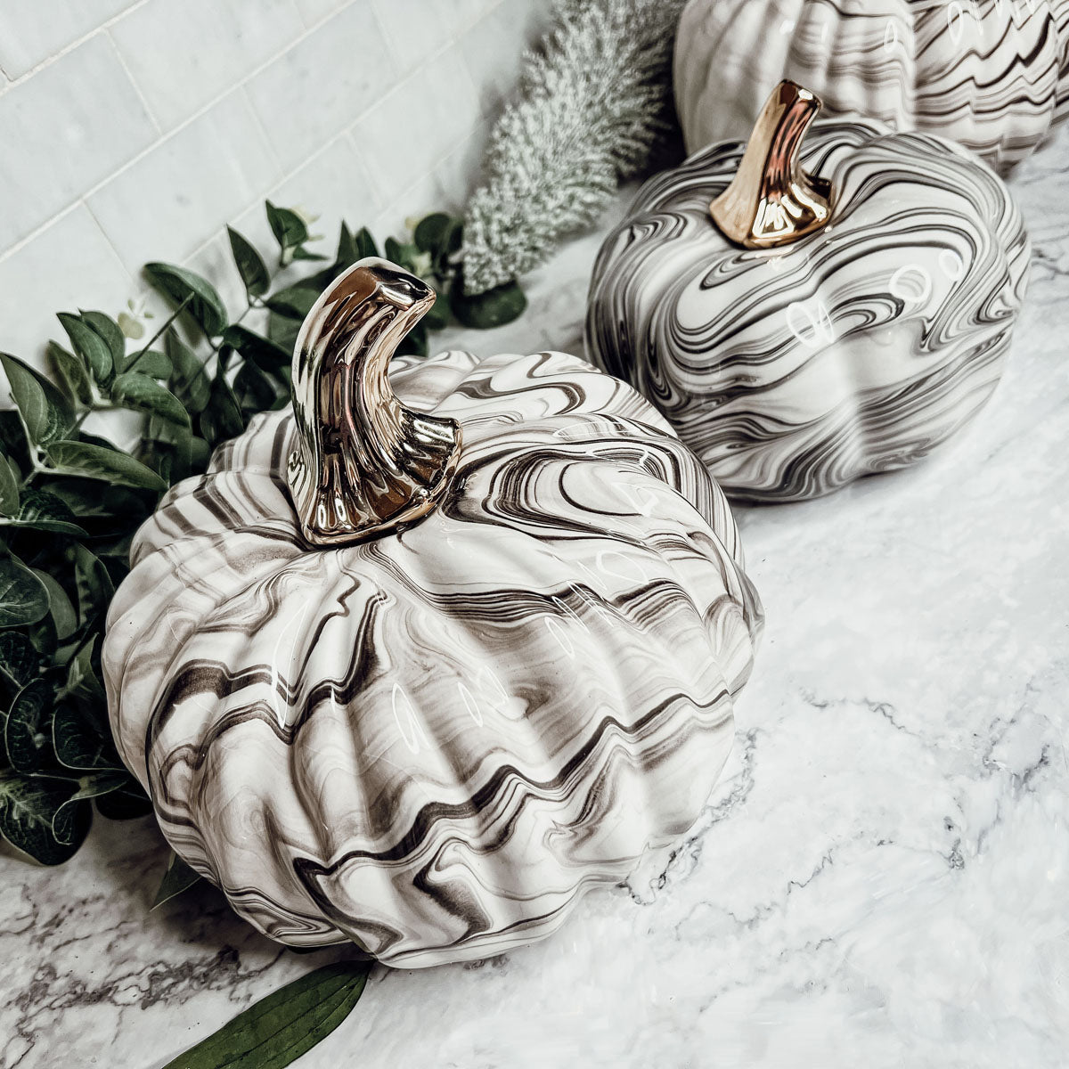 Black and white marble pumpkin decor with gold stems for elegant fall home decor