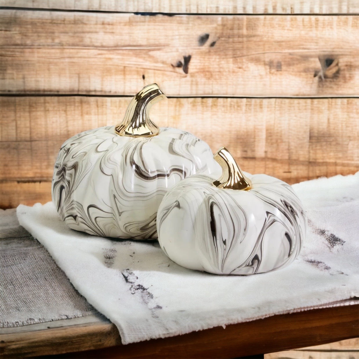 Black and white marble pumpkin decor with gold stems for elegant fall home decor